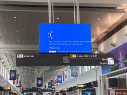 Information screen at airport giving microsoft blue screen of death error