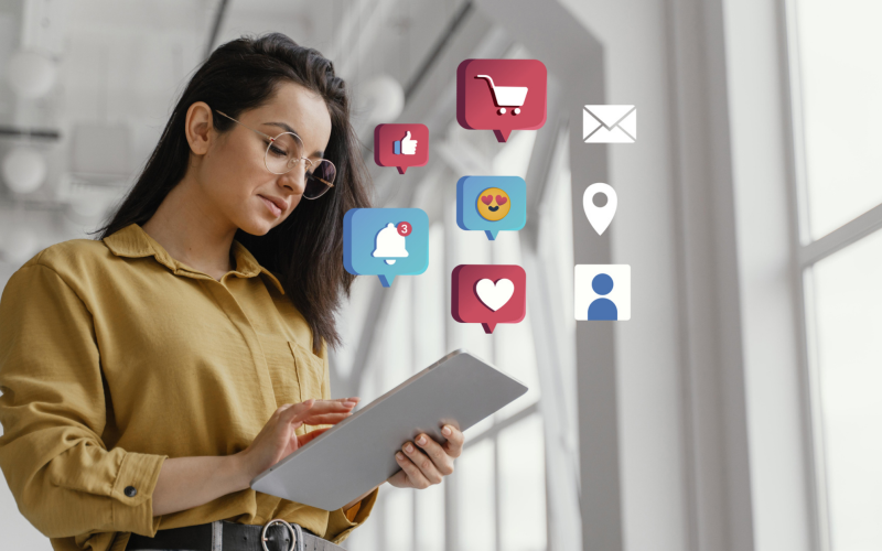 Girl holding the tablet with social media icons