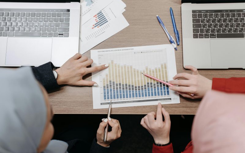 Team analyzing sales strategies using graphs and charts in a business meeting